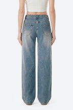 Women wearing retro blue wide leg stretch jeans