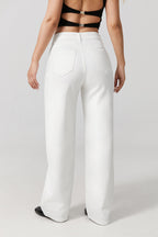 Women wearing white wide leg stretch jeans